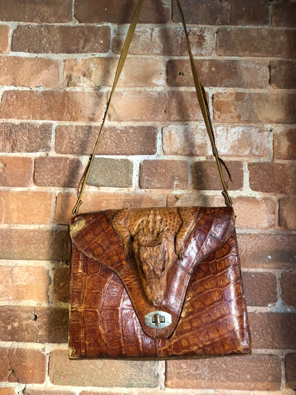 Kingspier Vintage - Rare brown reptile handbag with full alligator body detail, silver hardware, adjustable strap, leather lining and one inside zip pocket.