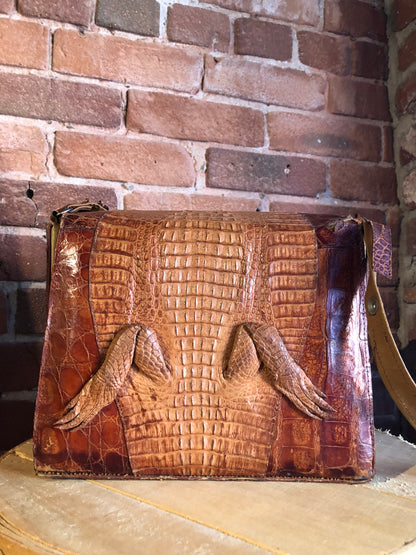 Kingspier Vintage - Rare brown reptile handbag with full alligator body detail, silver hardware, adjustable strap, leather lining and one inside zip pocket.