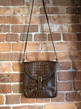 Load image into Gallery viewer, Kingspier Vintage - Brahmin croc-embossed leather crossbody handbag in pecan brown. This bag features brass hardware, snap buckle closure, back pocket and inside zip pocket. Made in the USA.
