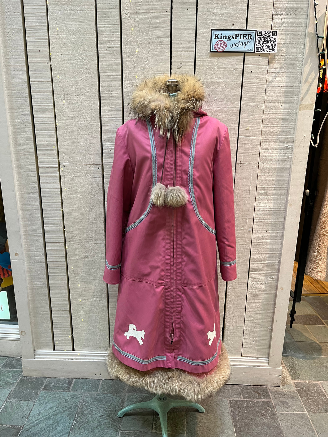 Vintage Yukon Indian Arts and Crafts LTD 100% pure virgin wool northern parka and nylon/ cotton blend removable shell with white leather applique, fur trimmed hood and pom poms, zipper closure, pockets, and hand embroidered flower details.

Made in USA
Size 16