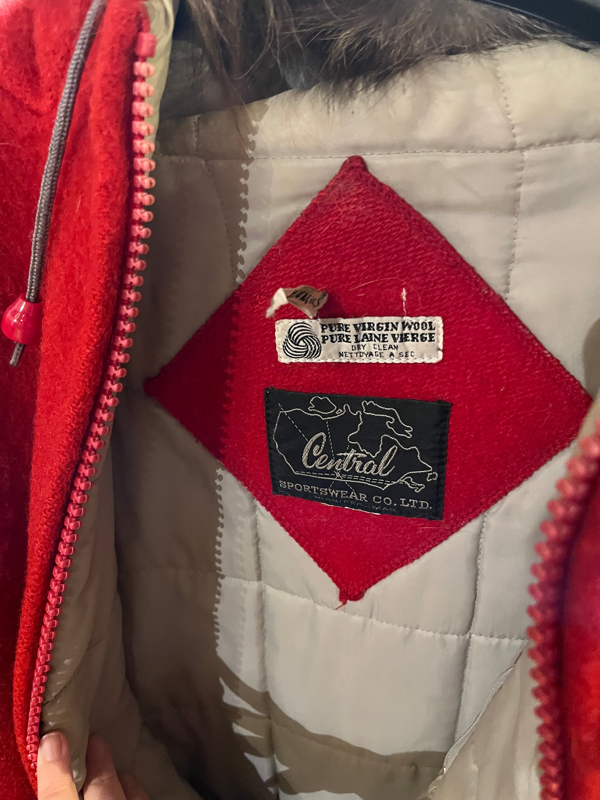 Vintage Central Sportswear Co. red 100% pure virgin wool northern parka with zipper closure, handwarmer pockets, quilted lining, fur trimmed hood and embroidered northern life motif.
 
Made in Canada
Size 12