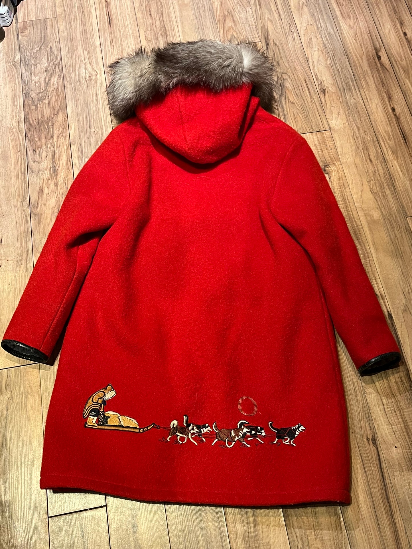 Vintage Central Sportswear Co. red 100% pure virgin wool northern parka with zipper closure, handwarmer pockets, quilted lining, fur trimmed hood and embroidered northern life motif.
 
Made in Canada
Size 12