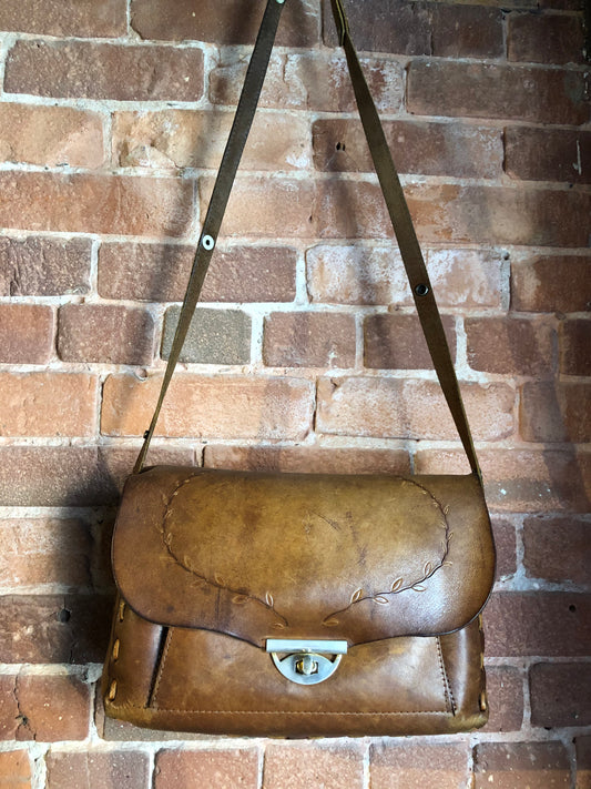 Kingspier Vintage - Hand tooled leather saddle bag with leather stitching, adjustable strap and brass front clasp.