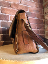 Load image into Gallery viewer, Kingspier Vintage - Hand tooled leather saddle bag with leather stitching, adjustable strap and brass front clasp.
