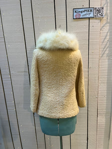 Vintage persian lamb white fur jacket with white Fur Collar, button closures and two front pockets.

Union made in Canada
Chest 34”