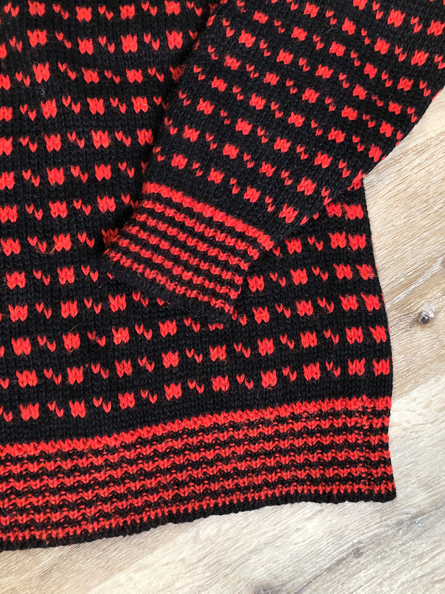 Kingspier Vintage - Hand knit black and red heritage print wool sweater. Made in Canada. Size L/XL.