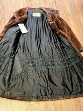 Load image into Gallery viewer, Vintage Furs by Offman brown fur coat with two from pockets, inside pocket, hook and eye closures and a satin lining with lace details.

Made in Canada
Size 10
