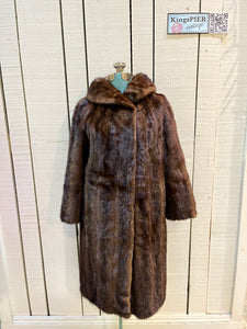 Vintage Furs by Offman brown fur coat with two from pockets, inside pocket, hook and eye closures and a satin lining with lace details.

Made in Canada
Size 10