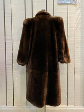 Load image into Gallery viewer, Vintage shorn beaver long fur coat with two front pockets, one inside pocket balloon sleeves and flower decorated button closures.

Chest 42”
