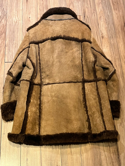 Vintage Sears “The Mens Store” shearling coat with two front pockets and button closures.

Size 44