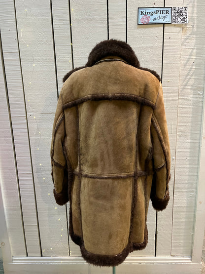 Vintage Sears “The Mens Store” shearling coat with two front pockets and button closures.

Size 44