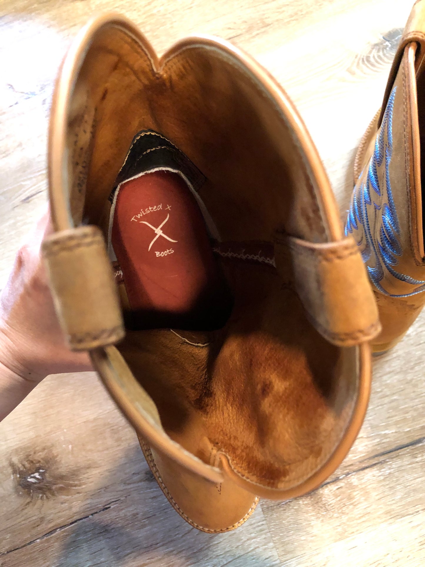 Twisted leather light brown cowboy boots with blue decorative stitching, leather lined with synthetic soles.  Size 10M, 12W US/ 43 EUR