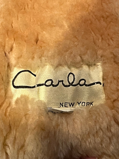 Vintage Carla New York shearling coat with hood, two front pockets and a zipper closure.

Chest 30”