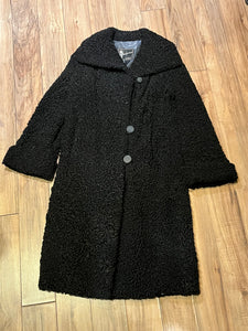 Vintage Maritime Furriers LTD black persian lamb fur coat with two front pockets, button closures and a satin lining with flower motif.

Chest 38”