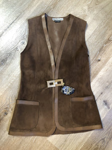 Vintage Mills Brothers deadstock 1960’s brown suede vest with large gold geometric front clasp, leather lining and trim and two patch pockets in the front. Suede and leather are buttery soft. Made in England - Kingspier Vintage