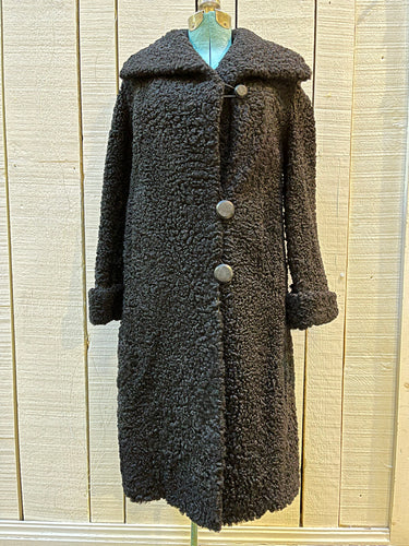 Vintage Maritime Furriers LTD black persian lamb fur coat with two front pockets, button closures and a satin lining with flower motif.

Chest 38”