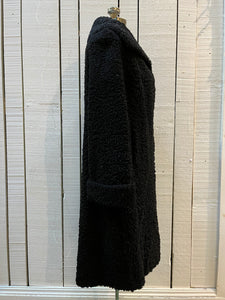 Vintage Maritime Furriers LTD black persian lamb fur coat with two front pockets, button closures and a satin lining with flower motif.

Chest 38”
