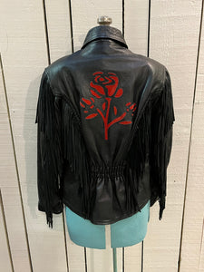 Vintage 80’s Antelope Creek leather jacket with fringe, lace up ties in at the sides, zipper closure and suede rose details. 

Made in Pakistan
Size Medium