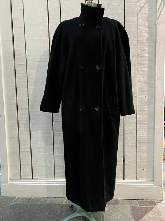 Vintage L’image by Irving Posluns wool blend (60% wool/ 25% cashmere/ 15% nylon) long black coat with unique button closures and two front pockets.
Union Made in Canada
Chest 42”