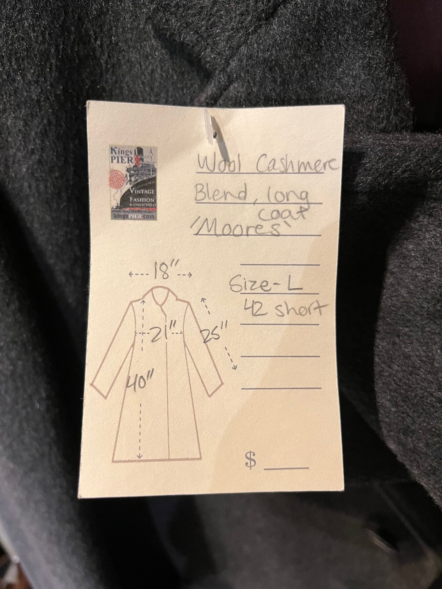 Vintage Moores wool blend long grey coat (65% wool/ 15% cashmere/ 15% polyester/ 5% other) with button closures, two front pockets and two inside pockets.

Made in Canada
Chest 42”