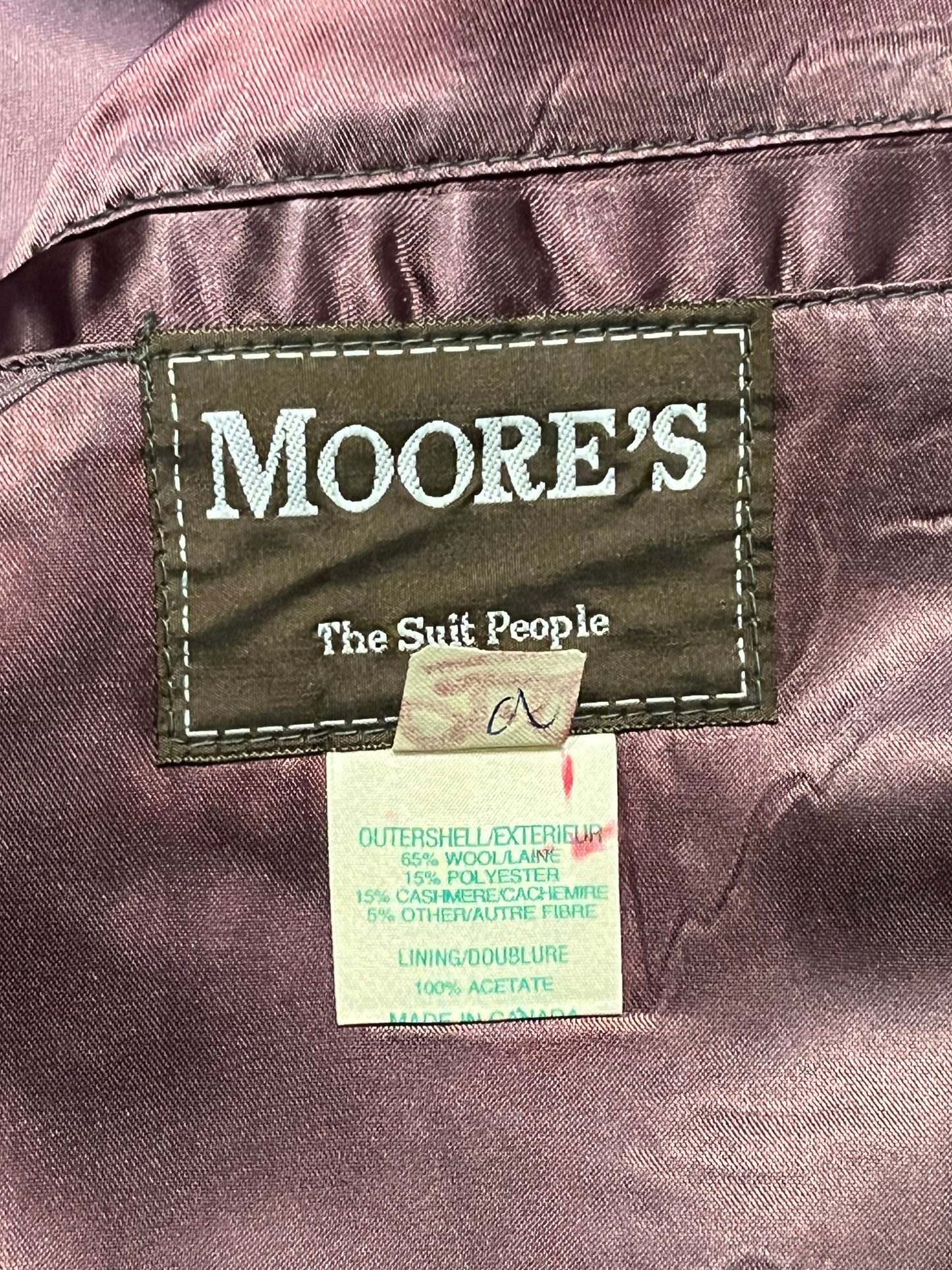 Vintage Moores wool blend long grey coat (65% wool/ 15% cashmere/ 15% polyester/ 5% other) with button closures, two front pockets and two inside pockets.

Made in Canada
Chest 42”