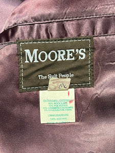 Vintage Moores wool blend long grey coat (65% wool/ 15% cashmere/ 15% polyester/ 5% other) with button closures, two front pockets and two inside pockets.

Made in Canada
Chest 42”