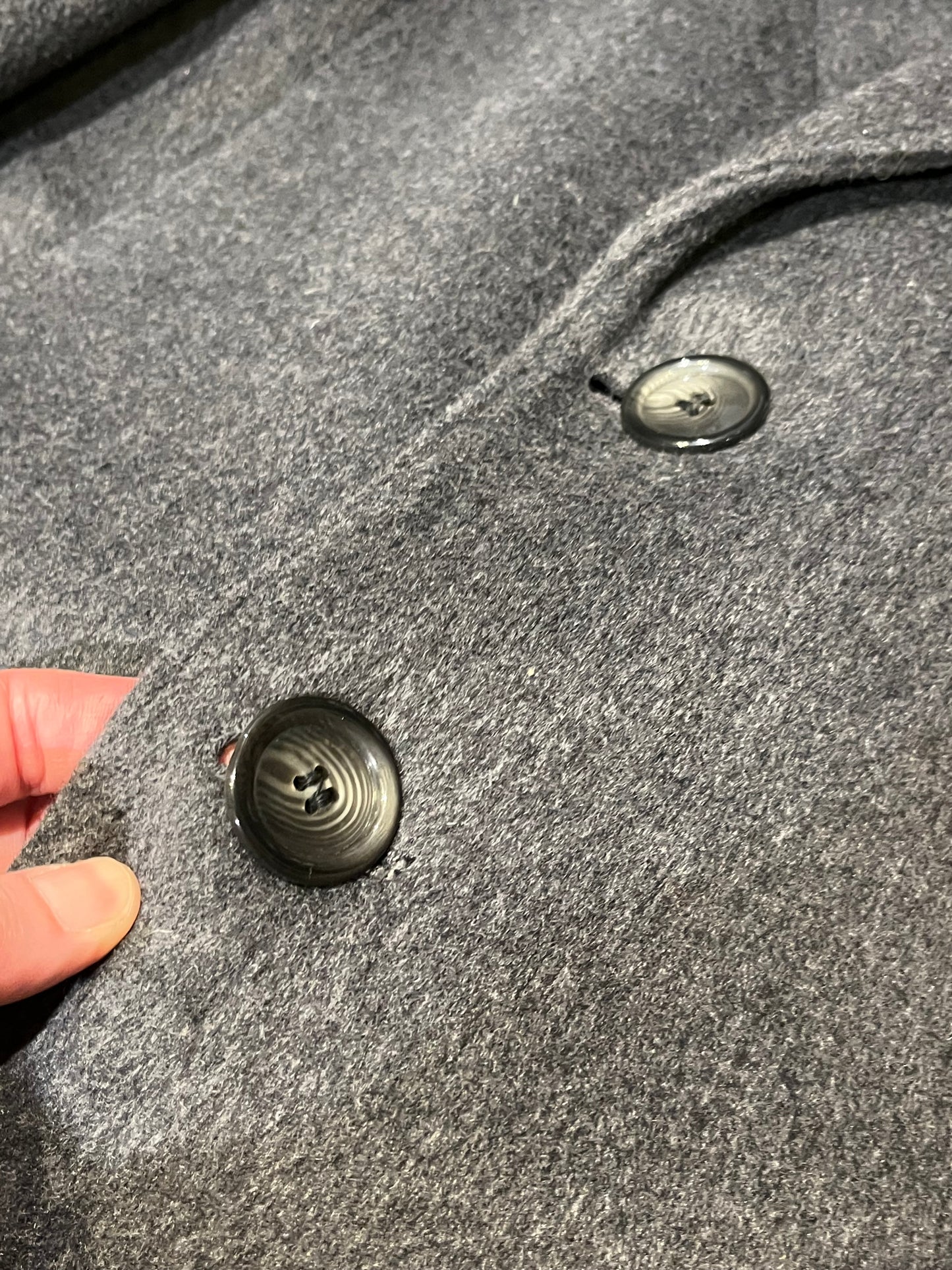 Vintage Moores wool blend long grey coat (65% wool/ 15% cashmere/ 15% polyester/ 5% other) with button closures, two front pockets and two inside pockets.

Made in Canada
Chest 42”