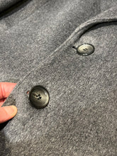 Load image into Gallery viewer, Vintage Moores wool blend long grey coat (65% wool/ 15% cashmere/ 15% polyester/ 5% other) with button closures, two front pockets and two inside pockets.

Made in Canada
Chest 42”

