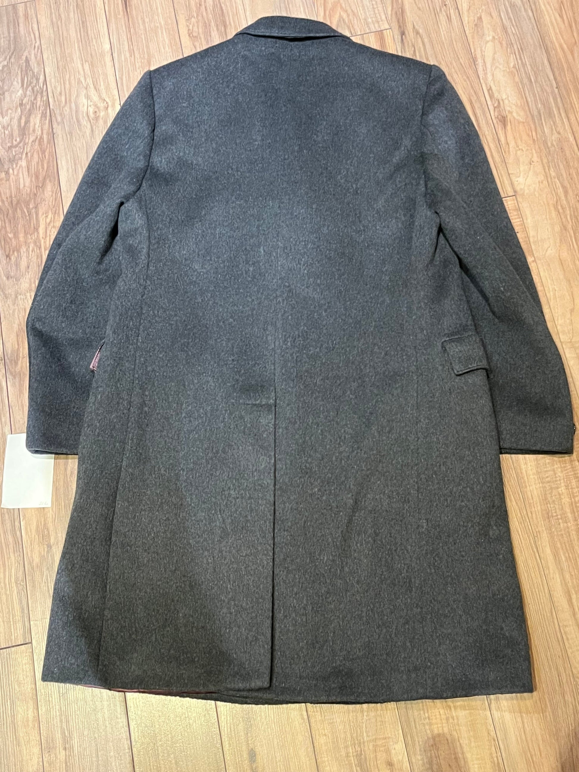 Vintage Moores wool blend long grey coat (65% wool/ 15% cashmere/ 15% polyester/ 5% other) with button closures, two front pockets and two inside pockets.

Made in Canada
Chest 42”