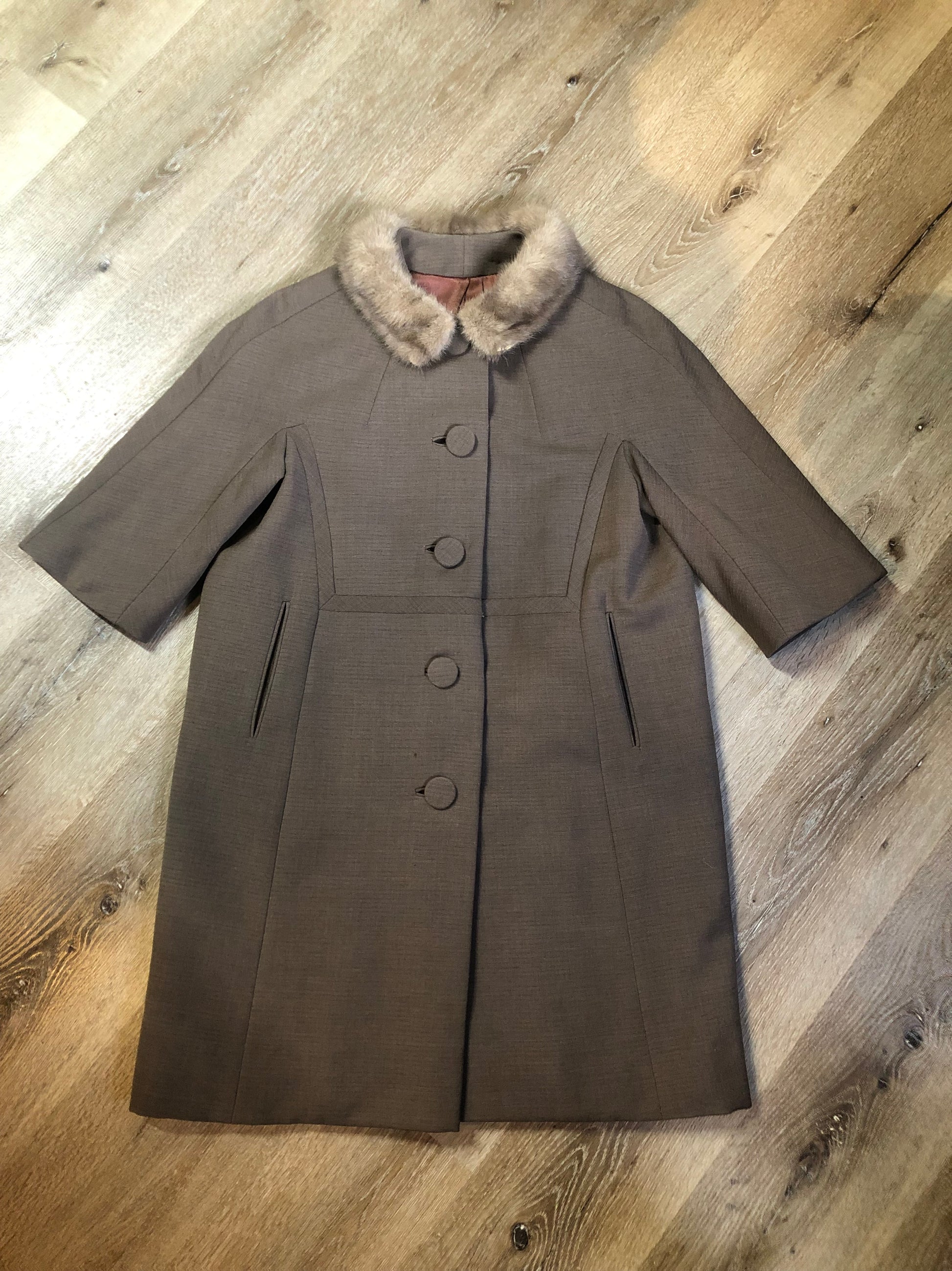 Vintage 1940s/ 1950s Monarch Wool Coat in taupe with ¾ sleeve and fur trimmed princess collar. Large covered buttons, satin lining, empire waist and handwarmer pockets. Fits like a medium - Kingspier Vintage