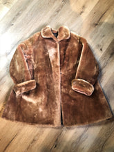 Load image into Gallery viewer, Vintage mid century blonde fur coat with unique blush undertones. Hook and eye closures with front pockets and satin lining with floral motif. Fur type unknown but it feels like shorn beaver fur - Kingspier Vintage
