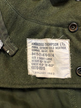 Load image into Gallery viewer, Kingspier Vintage - Canadian military surplus extreme cold parka in army green. The parka features zipper and buttons closure, flap pockets, knit collar, detachable hood, removable quilted lining and bottom hem drawstring. Size large. 
