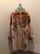 Load image into Gallery viewer, Vintage mid century blonde fur coat with unique blush undertones. Hook and eye closures with front pockets and satin lining with floral motif. Fur type unknown but it feels like shorn beaver fur - Kingspier Vintage
