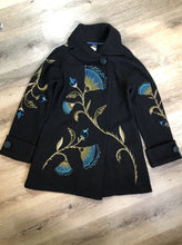 Load image into Gallery viewer, Kingspier Vintage - CoVelo Clothing black wool jacket with flower embellishments. Snap closures, side pockets and embroidered swirl decorative buttons. Size large.

