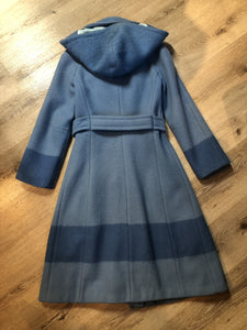 Hudson’s Bay Company Blue 100% virgin wool point blanket coat in a double breasted swing coat style with belt, detachable hood, button closures, slash pockets and satin lining. Made in Canada. Size small.