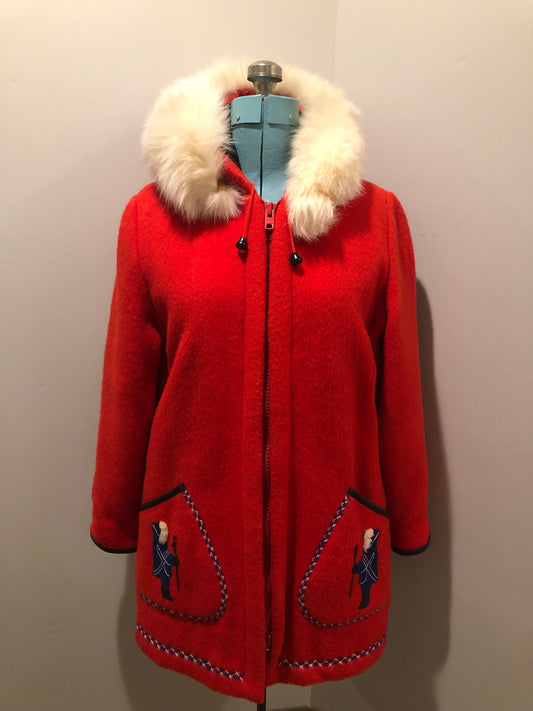 Vintage James Bay 100% virgin wool northern parka in bright red. This parka features a white fur trimmed hood, zipper closure, patch pockets, quilted lining, storm cuffs, embroidery details and northern fishing scene in felt applique. Made in Canada - Kingspier Vintage