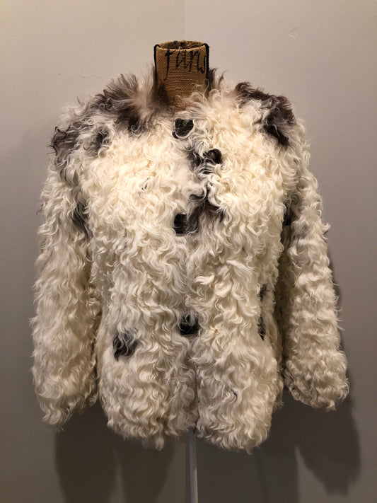 Kingspier Vintage - Vintage Mongolian sheepskin coat with soft and curly white and brown fur, pockets, pink satin lining, unique buttons and leather frog closures. Size small.