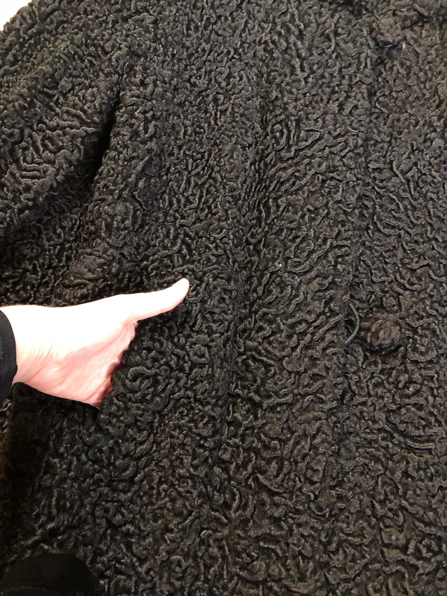 Kingspier Vintage - Vintage Rideau Furs black persian wool coat with wool buttons, pockets and black satin lining with delicate flower motif. Made in Nova Scotia. Size small/ medium.