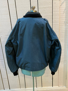 Vintage 1994 RCAF W8473-3ANON/01-PE Blue Bomber Jacket with zipper closure, multiple zip pockets and packaway hood.

Chest 52”