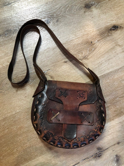 Vintage full grain brown leather crossbody bag with leather stitching, hand tooled designs and flap closure.  Made in Brazil - Kingspier Vintage