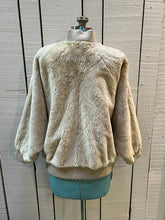 Load image into Gallery viewer, Very Rare Vintage Christian Dior beige shorn beaver shearling jacket with zipper closure, two front pockets and a knit trim.

Shoulder to shoulder - 17”
Shoulder to wrist - 20”
Armpit to armpit - 27”
Front length - 
Hem - 17”

*Flat lay measurements.

This coat is in excellent condition, zipper pull has a bit of damage which is shown in pictures.

