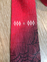 Load image into Gallery viewer, Kingspier Vintage - Abbey red tie with black spider web motif. Fibres unknown.

Length: 55”
Width: 2.5” 

This tie is in excellent condition.
