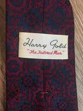 Load image into Gallery viewer, Kingspier Vintage - Harvey Gold tie in red and navy paisley design. Fibres unknown.

Length: 52.5” 
Width: 2.75” 

This tie is in excellent condition.
