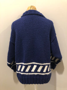 Kingspier Vintage - Hand knit royal blue cardigan with white design, collar and button closures. Made in Nova Scotia, Canada. Size large.
