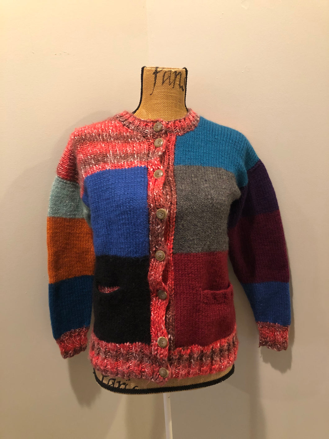 Kingspier Vintage - Hand knit Multi-Coloured patch work cardigan with button closures and pockets Made in Nova Scotia, Canada. Fibres unknown
