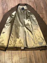 Load image into Gallery viewer, Vintage 70’s Cooper Sportswear camel brown trench coat with leather knot button closures, two front pockets and a satin lining.

Made in USA
Size 42
