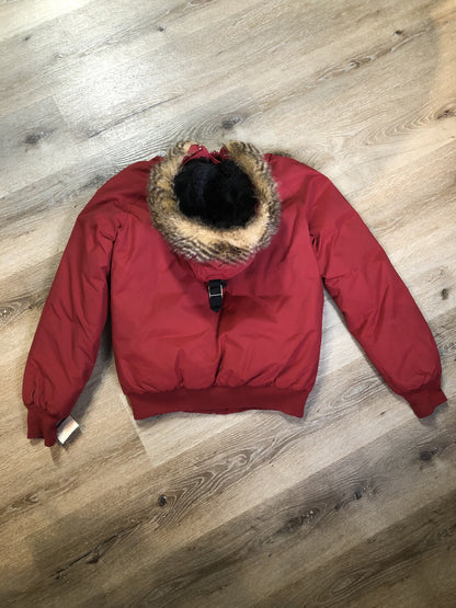 Kingspier Vintage - Roots down-filled bomber jacket in red with faux fur trimmed hood, zipper closure, flap pockets and slash pockets, “Stay Warm Eh” written on the inside pocket. Size medium.