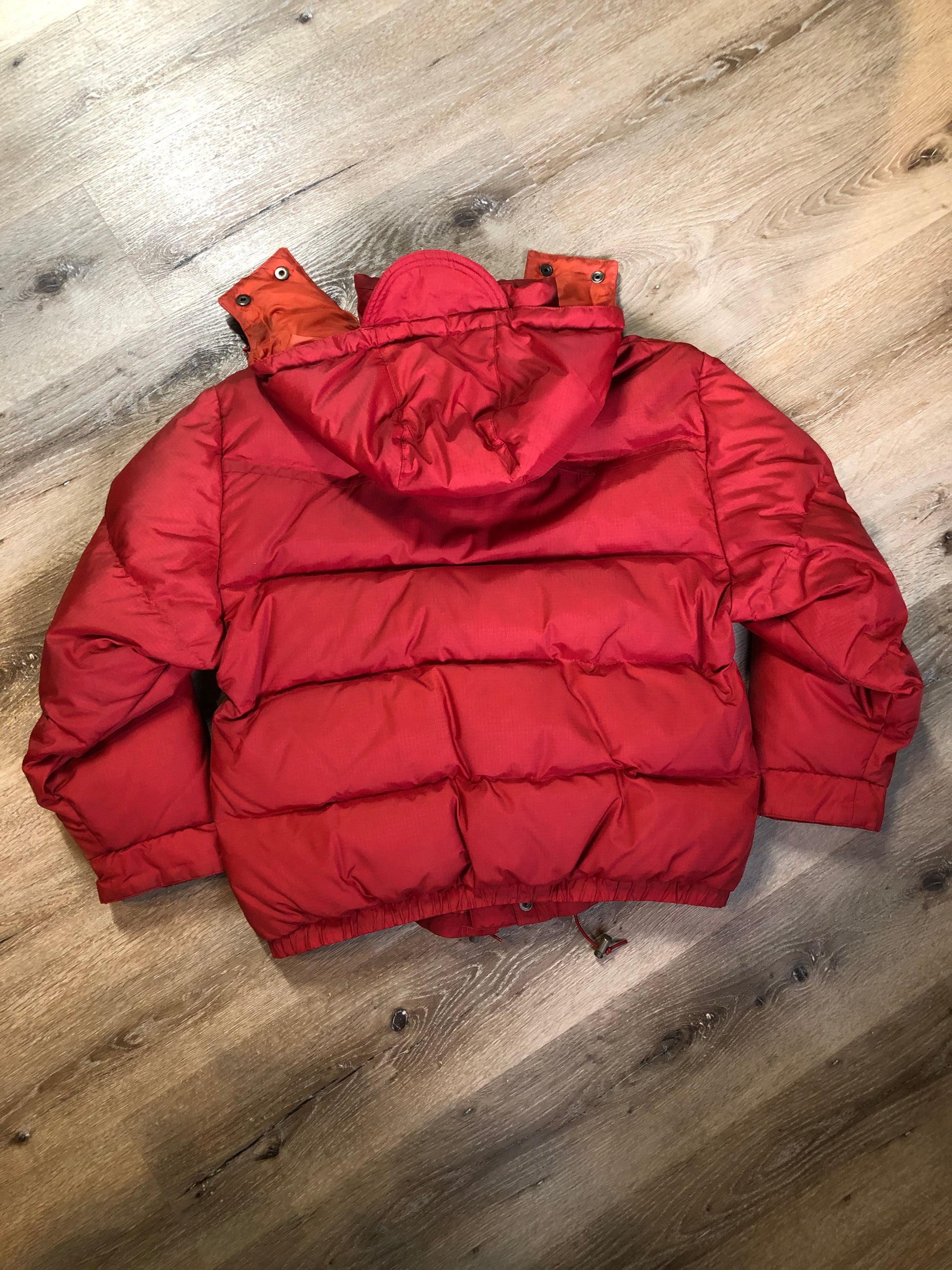 Kingspier Vintage - Vintage Jackpot by Carli Gry red down-fIlled puffer jacket with hood, zipper closure, flap pockets, zip pockets and three inside pockets large enough to fit an included small lightweight backpack, 