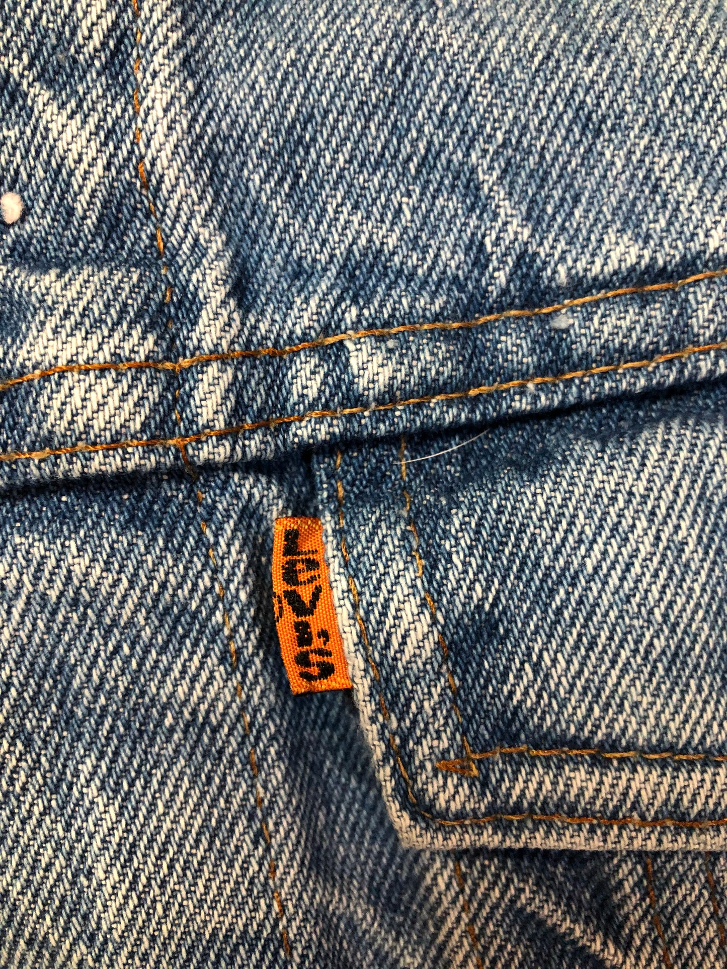 Vintage 1970’s Levi’s light wash denim trucker jacket with button closures and two flap pockets on the chest.  Orange Tab, 100% cotton, made in Canada, size 40  - Kingspier Vintage