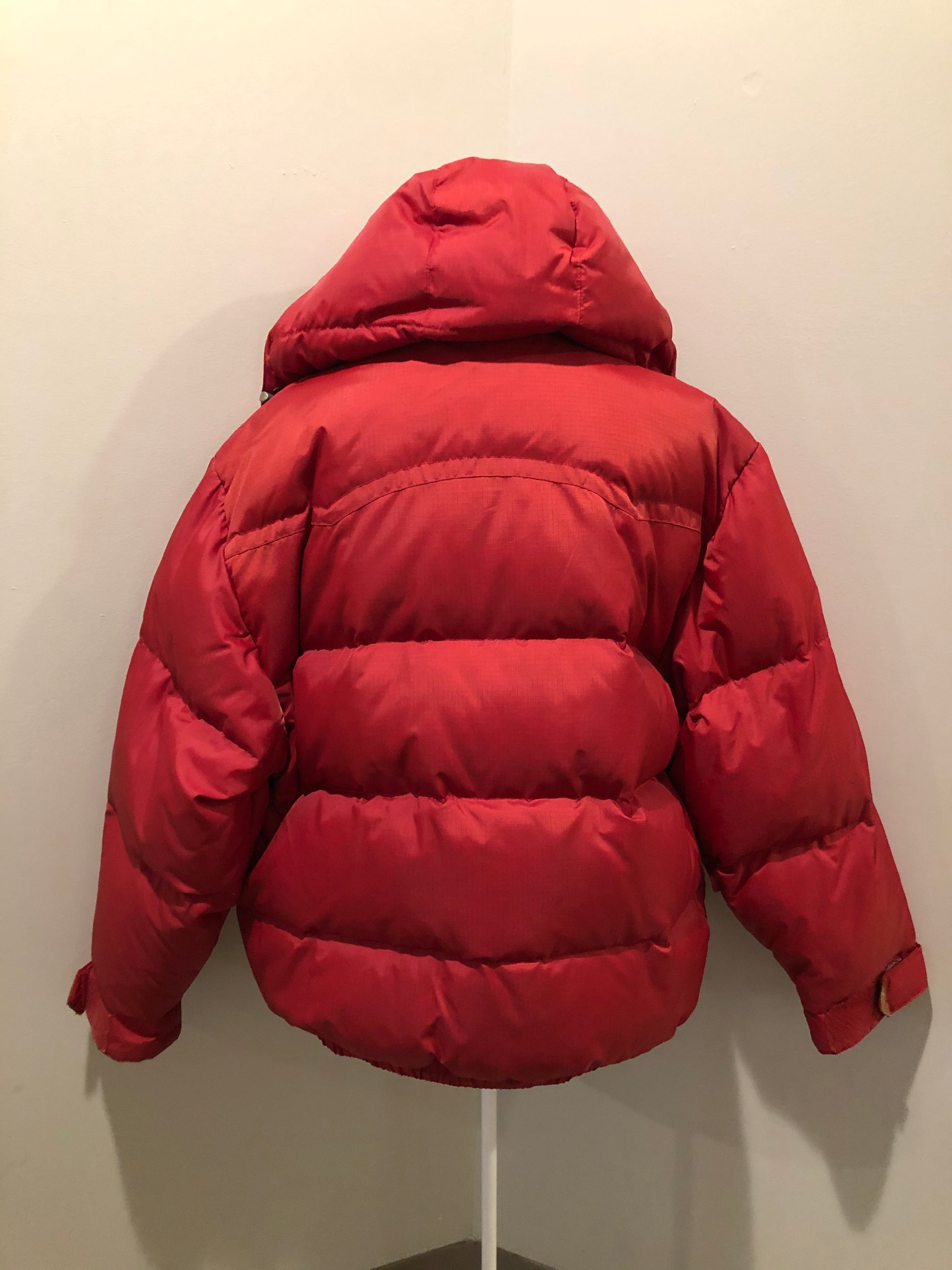 Kingspier Vintage - Vintage Jackpot by Carli Gry red down-fIlled puffer jacket with hood, zipper closure, flap pockets, zip pockets and three inside pockets large enough to fit an included small lightweight backpack, 